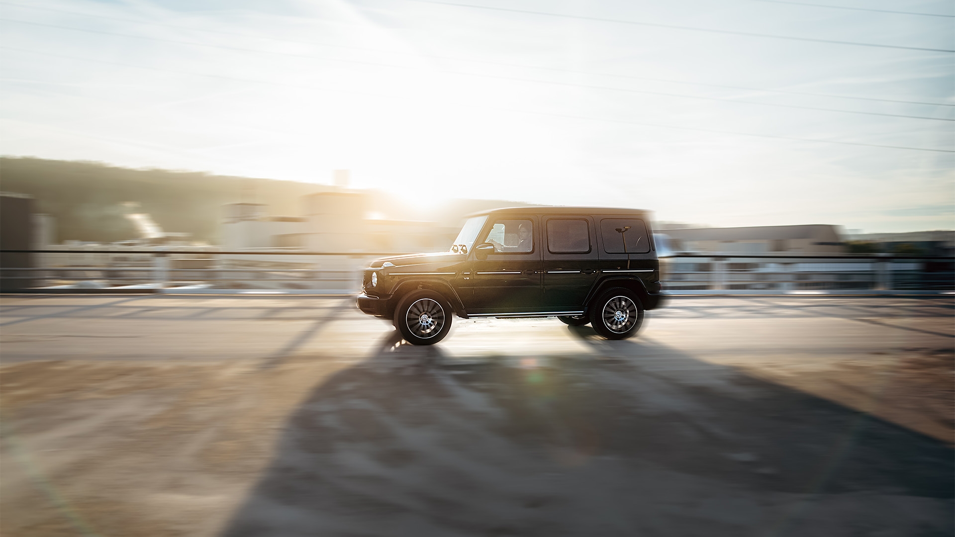 Mercedes-Benz G-Class driving through a landscape